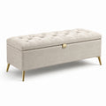 Panca contenitore in tessuto beige con gambe in metallo placcato