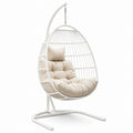 Sedia sospesa in metallo con cuscino in tessuto beige